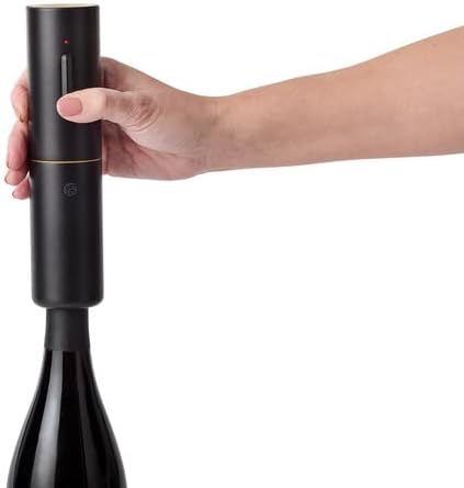 Hand holding a black wine bottle opener on a white background