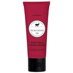 Red tube of Dionis Goat Milk Hand Cream on a white background