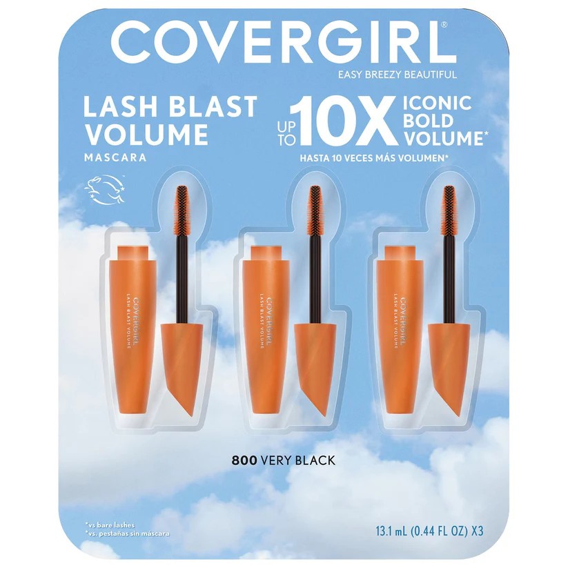 Covergirl Lash Blast Volume Mascara in a 3-pack of orange tubes with black applicators on a blue sky and clouds background card.