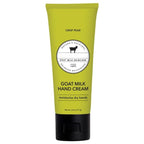 Green tube of goat milk hand cream on a white background
