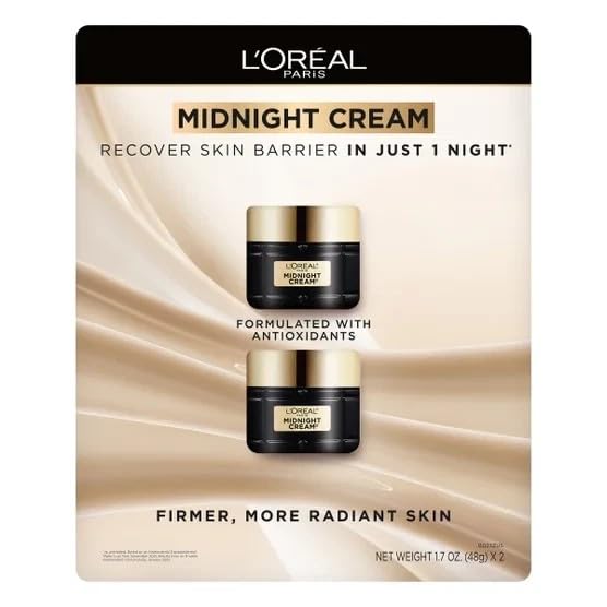 L'Oreal Paris Midnight Cream packaging with cream bottles on a beige background
