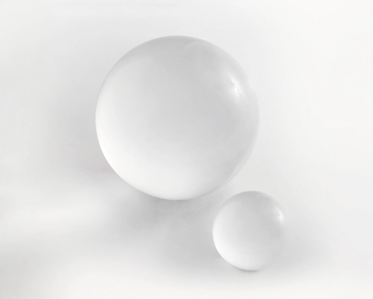 Two white spheres on a light gray background