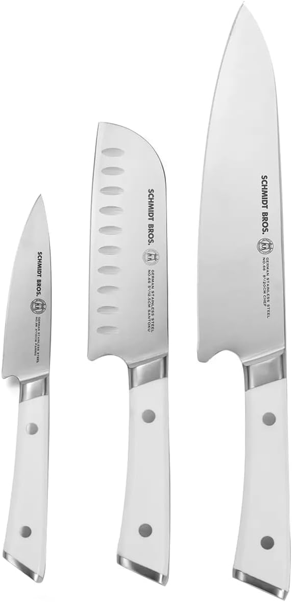 Set of three knives with white handles on a white background