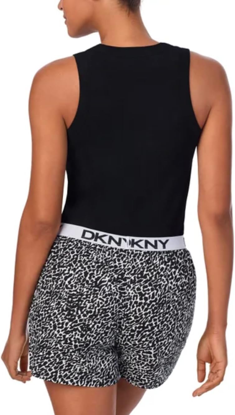 Person wearing a black tank top and patterned shorts with DKNY waistband.