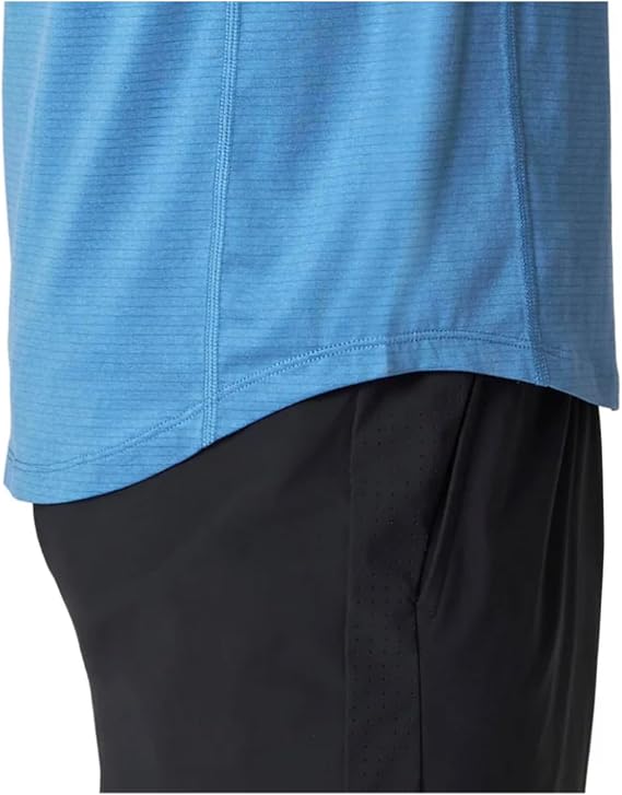 Close-up of a blue athletic shirt and black shorts on a white background