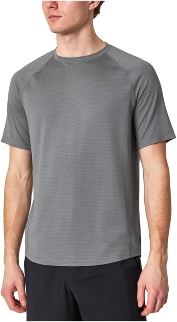Person wearing a gray t-shirt on a white background