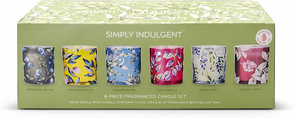 Set of six fragranced candles in colorful glass containers with floral designs on a green box labeled 'Simply Indulgent'.
