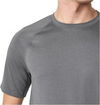 Gray short-sleeve shirt worn by a person on a white background