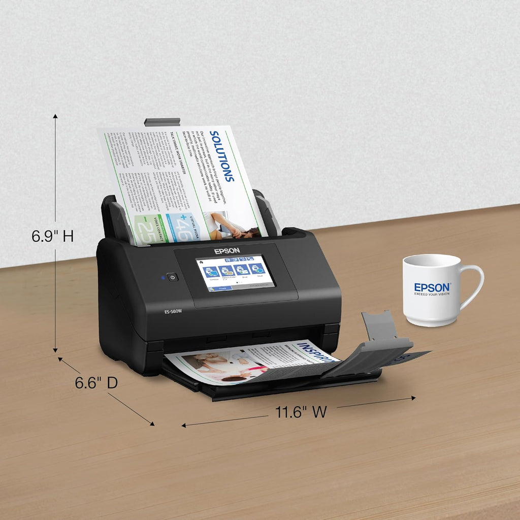 Epson document scanner on a table with dimensions labeled, next to an Epson mug.