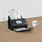 Epson document scanner on a table with dimensions labeled, next to an Epson mug.