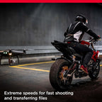 Person riding a motorcycle with a drone in the background, text about extreme speeds.