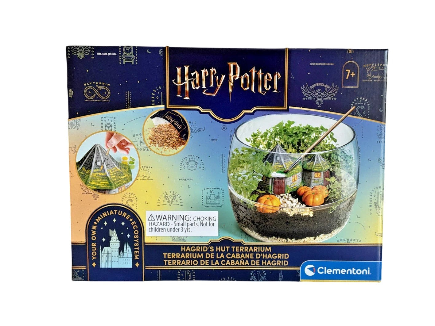 Clementoni Harry Potter Hagrid's Hut Terrarium kit box, featuring a dark blue and gold design with illustrations of the Harry Potter universe and a photo of the completed glass terrarium.
