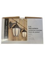 Packaging of two wall lanterns with a wooden background