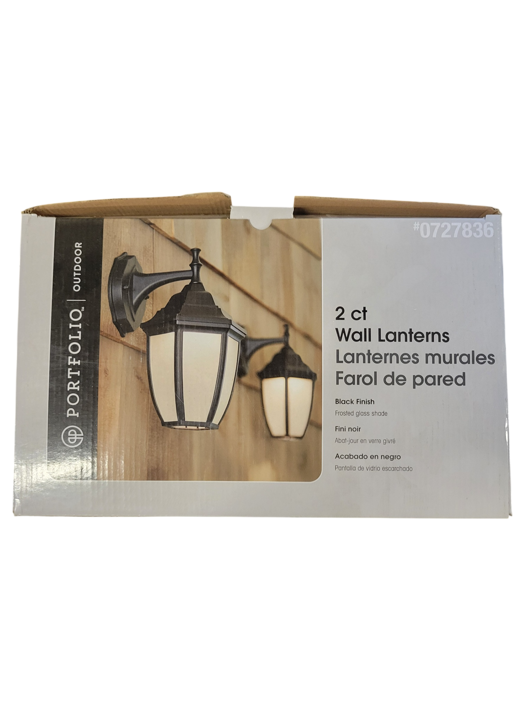 Packaging of two wall lanterns with a wooden background