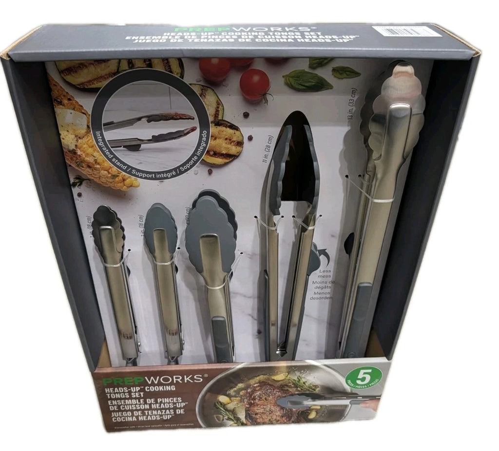 Boxed set of Five Works kitchen utensils with tongs and spatulas on a white background