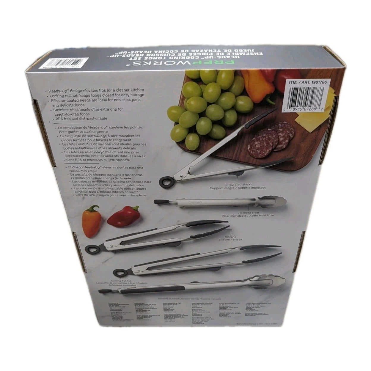 Box of kitchen tongs with images of fruits and vegetables on a white background