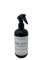 Black spray bottle labeled 'Home Ritual' on a white background